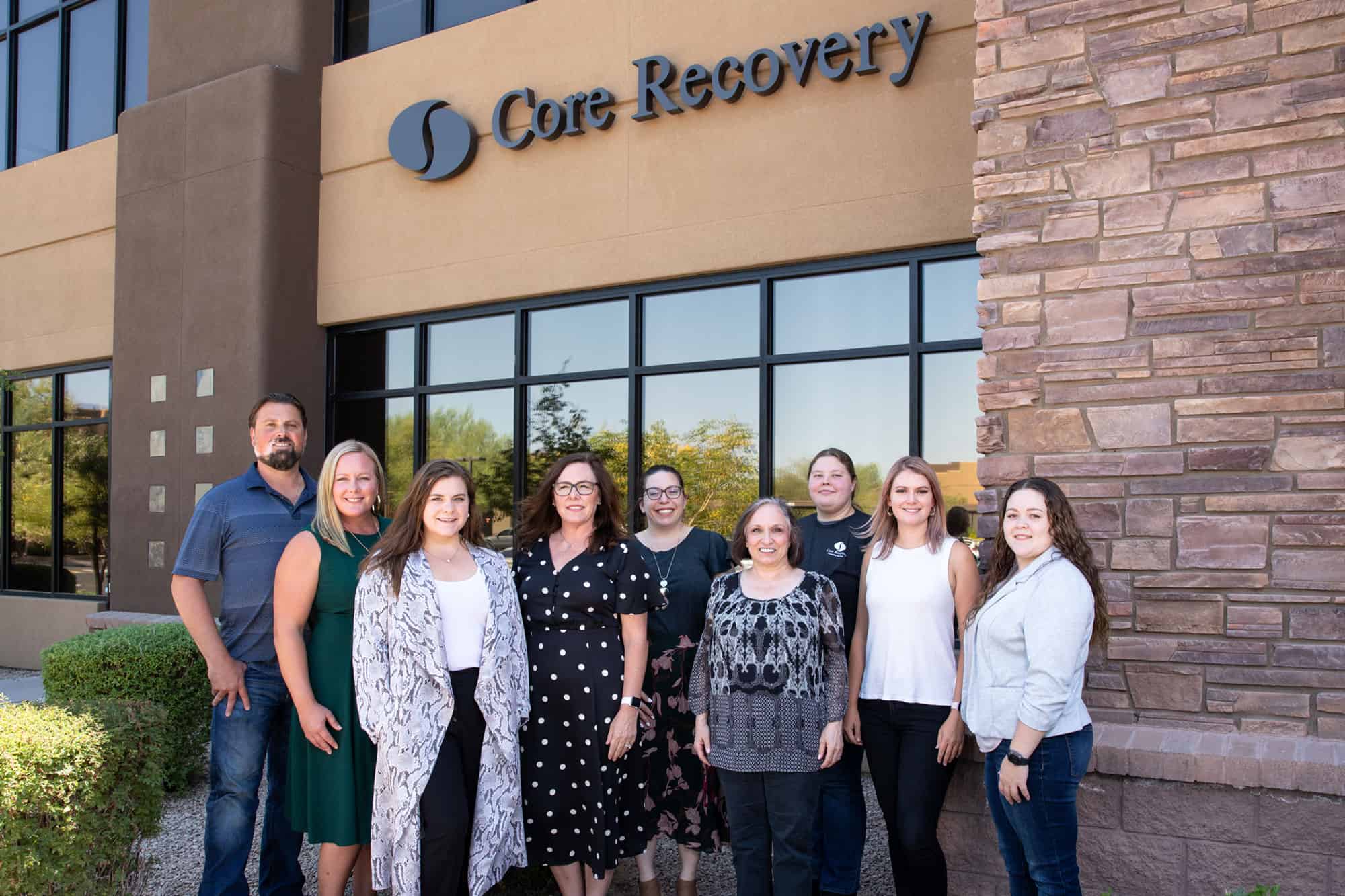 Core Recovery staff in front of their office team