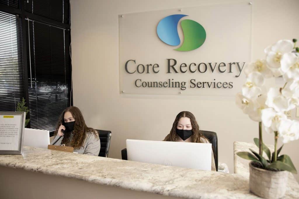 Interior of Core Recovery with woman answering phones Mental Health Treatment Centers