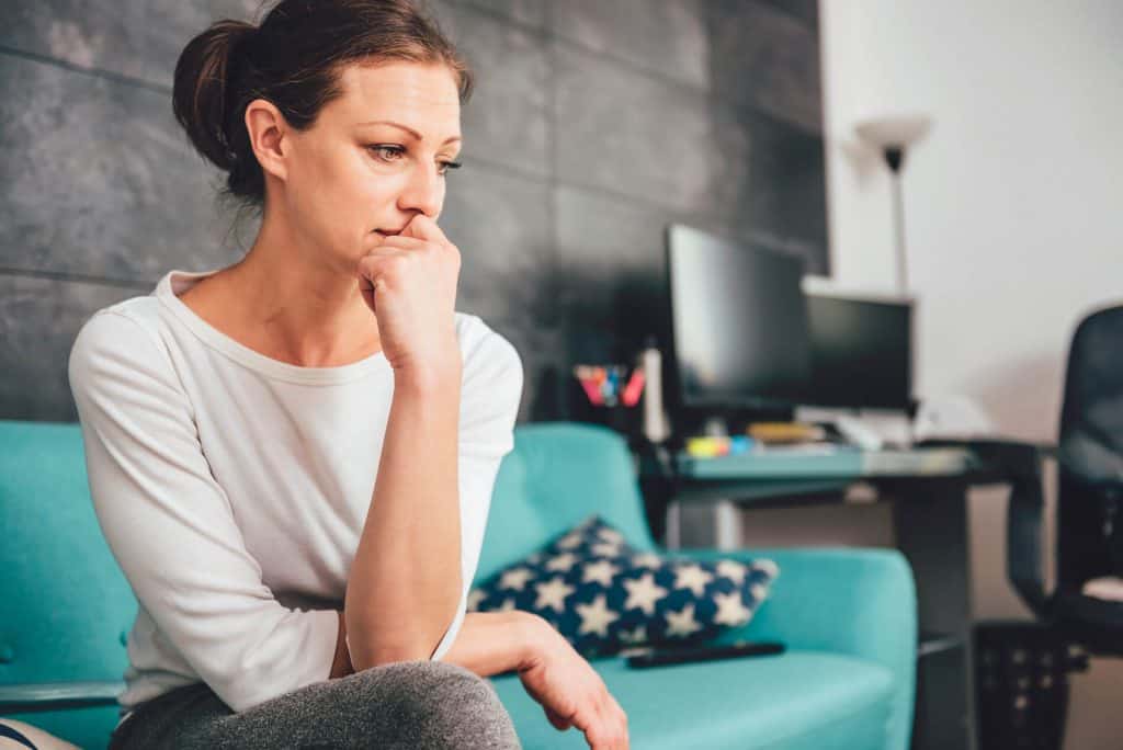 Woman on a couch in contemplation generalized anxiety disorder