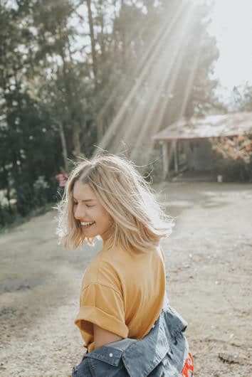 Photo of a girl smiling in the sunlight