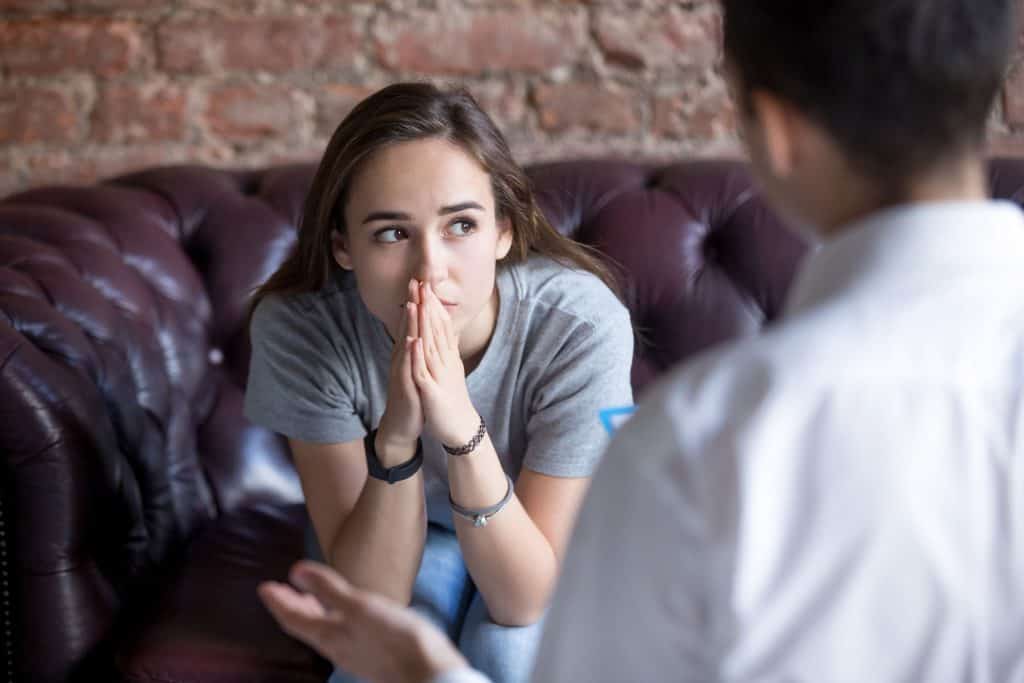 Young woman listening to another person