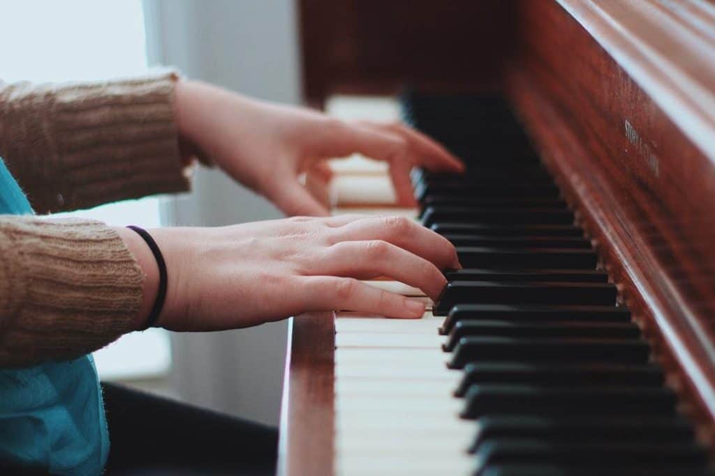 A person playing a piano music therapy