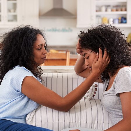 Mother speaking to distressed daughter