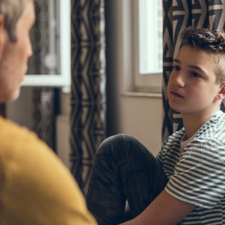 Teen talking with older man for Teen Suicide Prevention